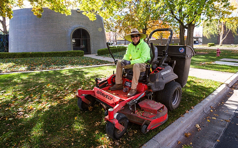 Julio on a mower at Intermountain Gas