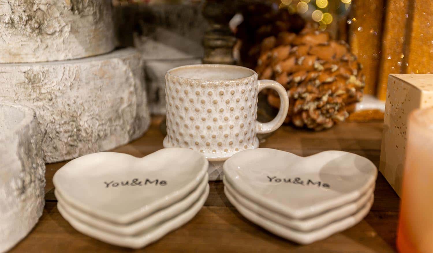 white mugs with decorative heart-shaped dishes